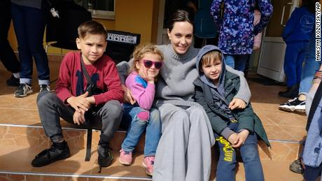 Angelina Jolie poses for photo with children in Lviv, Ukraine, on Saturday, April 30, 2022. 