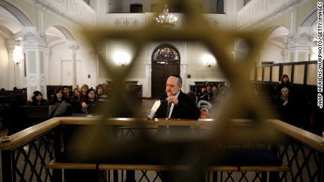 Chief Rabbi of Poland Michael Shudrich lights a candle on International Holocaust Remembrance Day at the Nozyk synagogue in Warsaw, Poland on January 27, 2019. (Photo by Jaap Arriens/NurPhoto via Getty Images)