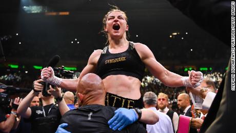 Katie Taylor celebrates victory after her undisputed world lightweight championship fight with Amanda Serrano at Madison Square Garden in New York.