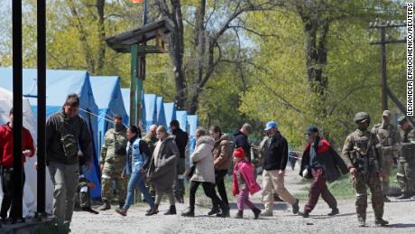 Civilians evacuated from Mariupol arrive at the Russian filtration camp in Bezimenne in eastern Ukraine on May 1, 2022.