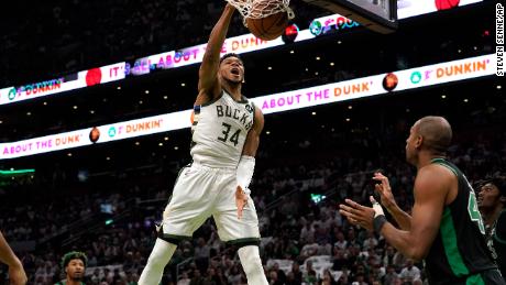 Giannis Antetokounmpo dunks against the Boston Celtics.