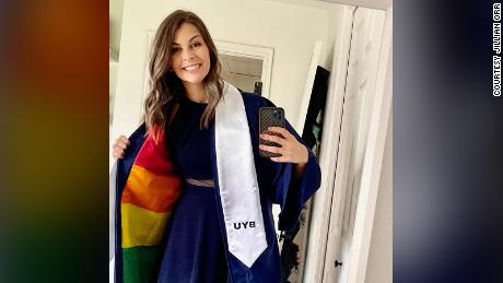 Brigham Young University graduate Jillian Orr sewed a rainbow flag into her gown, a nod to LGBTQ students at the university, which doesn&#39;t allow demonstrations of same-sex relationships. 