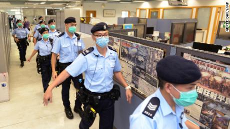 Police officers raid the Apple Daily headquarters in Hong Kong on August 10, 2020.