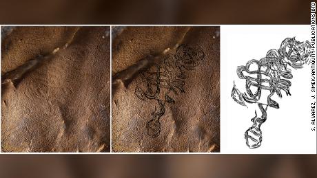 An enigmatic figure made of of swirling lines, with a round head and a possible rattlesnake tail, was one of four discovered in an Alabama cave.