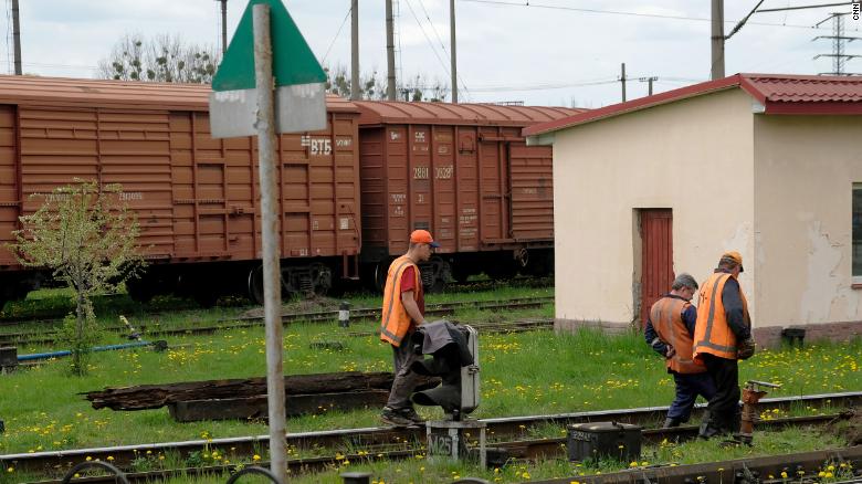 Railway workers fix a part of the railway line that connects Lviv to Poland.