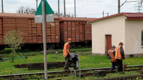 Railway workers fix a part of the railway line that connects Lviv to Poland.