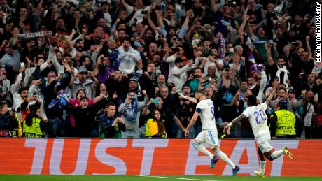 Karim Benzema celebrates after scoring the winning penalty.