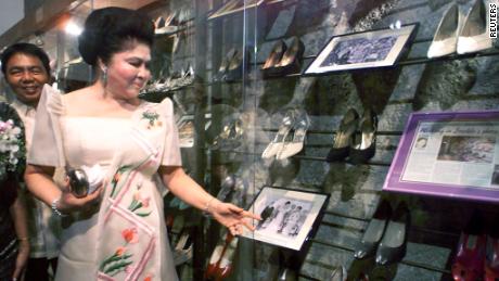 Imelda Marcos sees her old shoes during the inauguration of a shoe museum in Manila, 2001. 