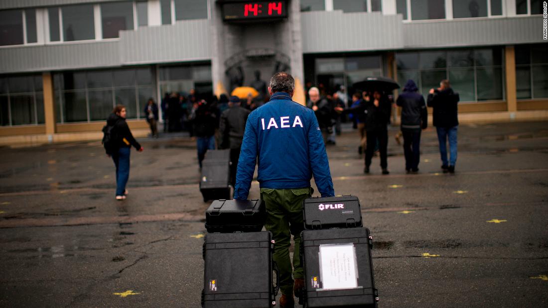 A team member with the International Atomic Energy Agency arrives at the Chernobyl nuclear power plant in Chernobyl, Ukraine, on April 26. Russian forces withdrew from Chernobyl, the site of the world&#39;s worst nuclear disaster, in March.