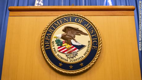 The U.S. Department of Justice seal on a podium in Washington, D.C., U.S., on Thursday, Aug. 5, 2021. The Justice Department has opened an investigation into the City of Phoenix and the Phoenix Police Department looking into types of use of force by Phoenix police department officers. Photographer: Samuel Corum/Bloomberg via Getty Images