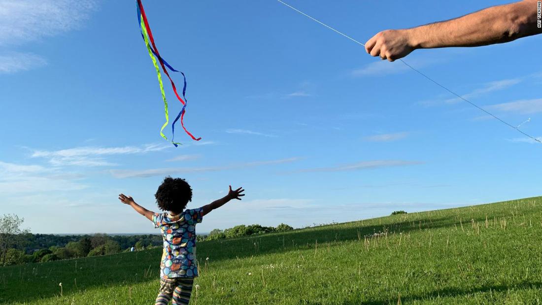 &lt;a href=&quot;http://www.amytoensing.com/&quot; target=&quot;_blank&quot;&gt;Amy Toensing&lt;/a&gt; photographed her daughter,  Elsa, chasing a kite flown by her husband. &quot;We were fortunate enough to become a family through adoption,&quot; she said. &quot;Being a mom challenges, fulfills and humbles me every day. My daughter has opened my world and makes me want to know more about myself so I can be more present with her. She is the love of my life.&quot;