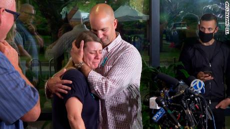 A tearful Nichole Schmidt, the mother of Gabby Petito, is comforted by her husband Jim Schmidt during a news conference on Tuesday, September 28, 2021, in Bohemia, New York.