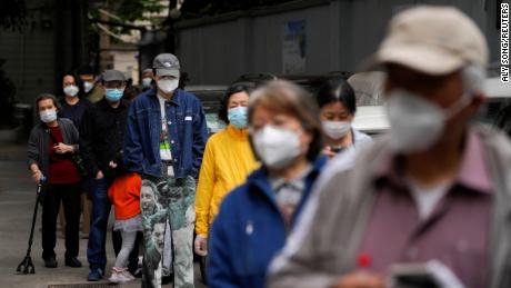 Residents line up for nucleic acid tests during lockdown, amid the coronavirus disease (COVID-19) pandemic, in Shanghai, China, May 9, 2022. REUTERS/Aly Song