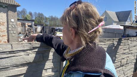 &quot;Nika&quot; points to a bullet hole made by Russians who she says raped her.
