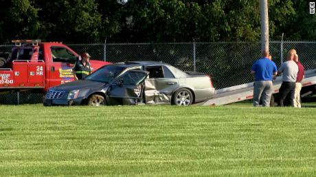 An image of a damaged car at the scene where the chase ended. 