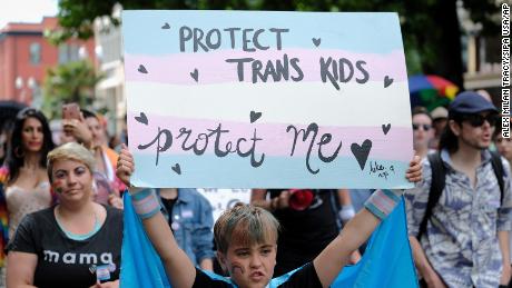 A young child takes part in the Trans Pride March celebrating gender identity in Portland, Oregon, on June 16, 2018. 