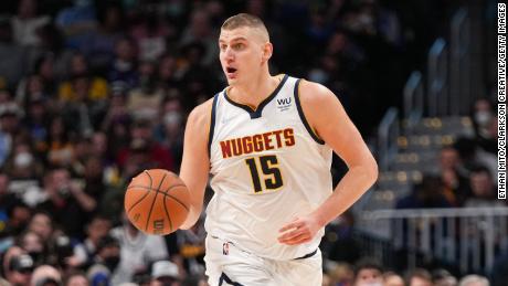 Jokic dribbles past the Memphis Grizzlies at Ball Arena on January 21, 2022.