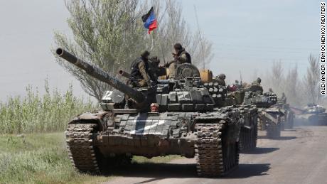 Service members of pro-Russian troops drive armored vehicles near Novoazovsk in Ukraine&#39;s eastern Donetsk region on May 6, 2022.