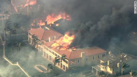 A fast-moving fire consumed homes in Orange County, California, Wednesday. 