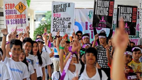 Filipino youths and children at a rally to draw attention to sexual abuse of women and children as part of the &quot;One Billion Rising&quot; campaign.  