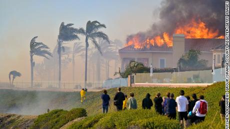 A home burns Wednesday on Coronado Pointe during the Coastal Fire in Laguna Niguel.