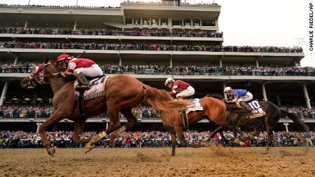 Rich Strike (number 21), with Sonny Leon aboard, races to victory at the 2022 Kentucky Derby on May 7.