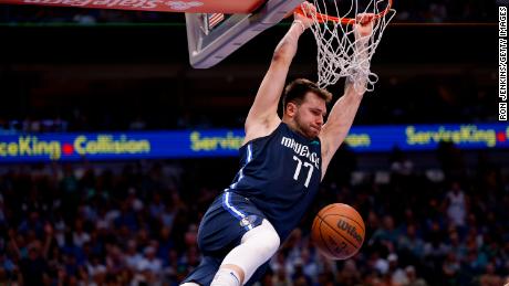 Luka Doncic dunks the ball against the Phoenix Suns in the Mavericks&#39; dominating Game 6 win.