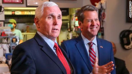 Vice President Mike Pence, left, speaks as Georgia Gov. Brian Kemp, right, listens at the Star Cafe in Atlanta, Friday, May 22, 2020, during the coronavirus pandemic. (John Spink/Atlanta Journal-Constitution via AP)