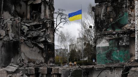 A Ukrainian flag flies in a damaged residential area in the town of Borodianka, northwest of the Ukrainian capital Kiev.