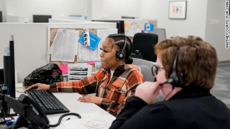 From left, Brittany Bester and Natalee Clemons work the phones in the call center at Planned Parenthood in Fairview Heights, Illinois.
