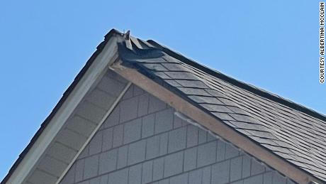 Damage can be seen on the roof where the paratrooper landed. 