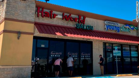 This photo shows the exterior of Hair World Salon in Dallas, where police say Wednesday&#39;s shooting took place. 