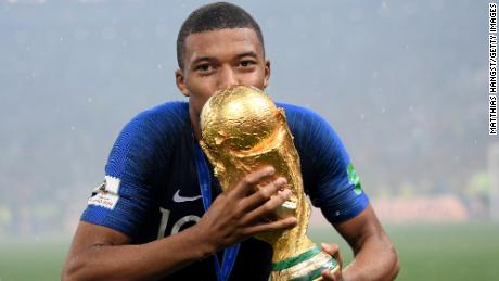 Mbappé celebrates after France wins the 2018 World Cup.
