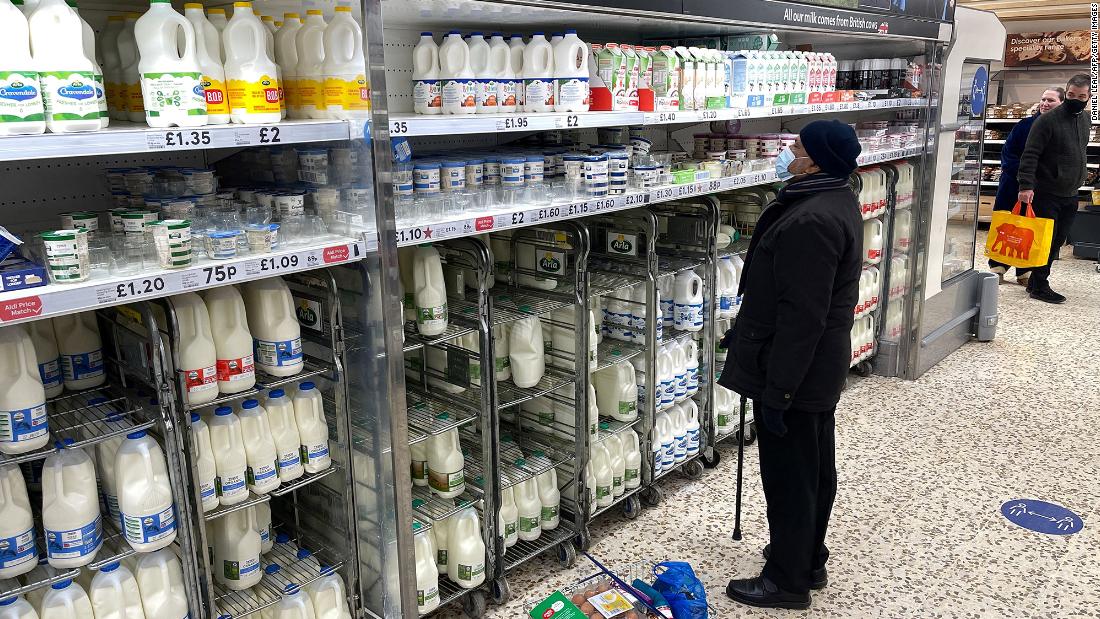 A customer shops for food items inside a Tesco supermarket store in east London.