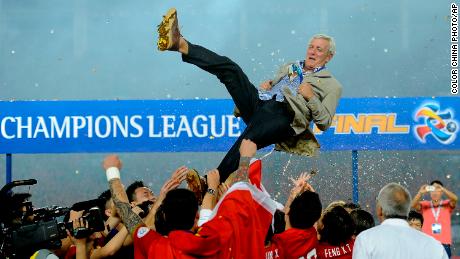 Guangzhou Evergrande players throw their coach Marcello Lippi into the air after winning the 2013 Asian Champions League final.