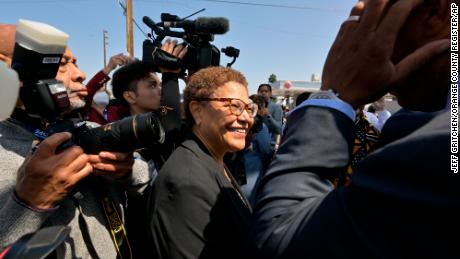 Congresswoman Karen Bass arrives at a press conference recognizing the 30th anniversary of the L.A. Riots at the corner of Florence Avenue and Normandie Avenue in Los Angeles, on Friday, April 29, 2022. 