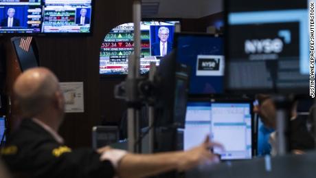 A screen shows a press conference with Jerome Powell, the Chair of the Federal Reserve of the United States, following news about the Federal Reserve decision to raise interest rates by half a percentage point on the floor of the New York Stock Exchange on May 4, 2022.