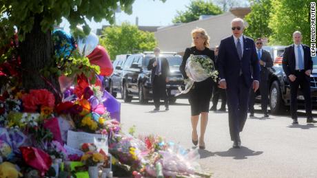 U.S. President Joe Biden and first lady Jill Biden pay their respects to the 10 people killed in a mass shooting by a gunman authorities say was motivated by racism, at the TOPS Friendly Markets memorial site in Buffalo, NY, U.S. May 17, 2022. REUTERS/Leah Millis
