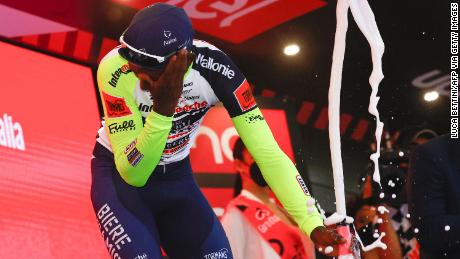 Biniam Girmay accidentally popped a cork into his eye after the 10th stage of the Giro d&#39;Italia.