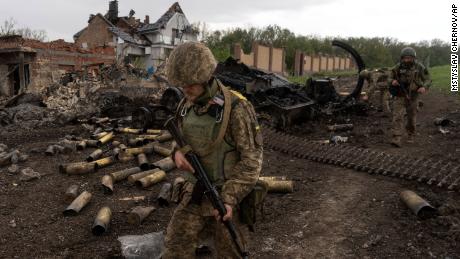 Ukrainian servicemen patrol in a recently retaken village, north of Kharkiv, east Ukraine, Sunday, May 15, 2022. (AP Photo/Mstyslav Chernov)