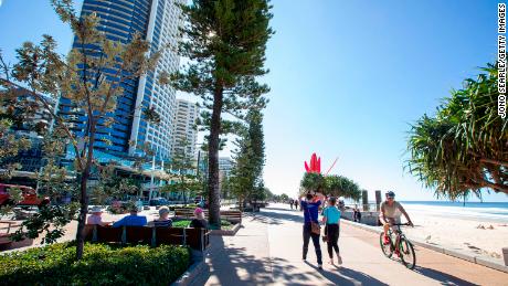People walk along the Esplanade at Surfers Paradise in Gold Coast, Australia. The city has become a popular destination for people moving north following larger Covid outbreaks in southern states.