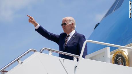 President Joe Biden gestures as he boards Air Force One for a trip to South Korea and Japan, May 19, 2022.