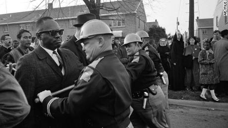 On March 13, 1965, police stop protesters protesting for the right to vote in Selma, Alabama.