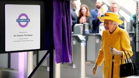Queen Elizabeth II unveils a plaque to mark the official opening of the Elizabeth Line.