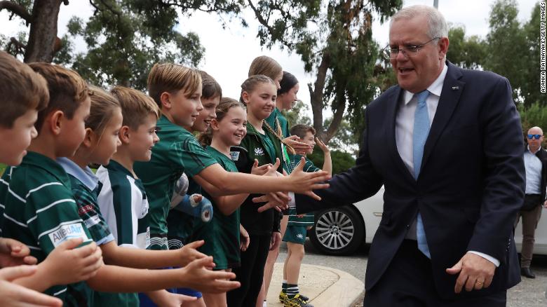 Prime Minister Scott Morrison greets children from the Wanneroo Rugby Union Club in Perth, May 20.