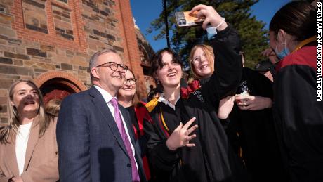 Opposition Labor Party leader Anthony Albanese poses with students from Cobra Dominican College in Adelaide on May 20.