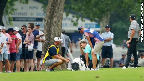 Wise reacts on the seventh hole after being hit by Smith&#39;s ball.