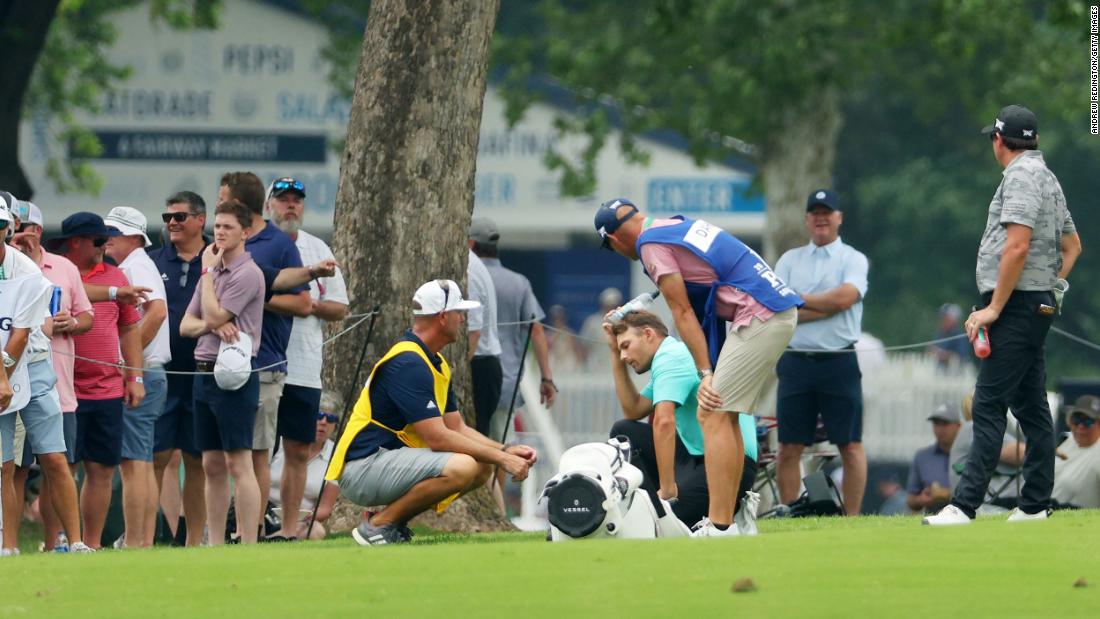 &lt;a href=&quot;https://edition.cnn.com/2022/05/20/golf/aaron-wise-hit-with-ball-pga-championship-spt-intl/index.html&quot; target=&quot;_blank&quot;&gt;Aaron Wise&lt;/a&gt; kneels on the seventh hole after being hit by a ball played by Cameron Smith during the second round.