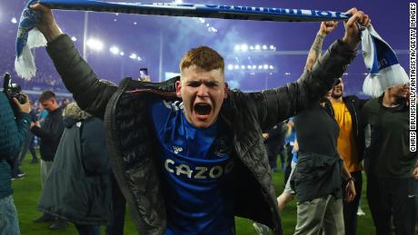 An Everton fan celebrates full time after Everton's win against Crystal Palace.