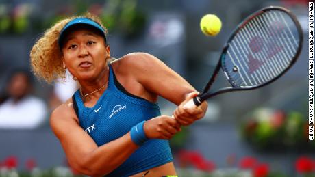 Naomi Osaka of Japan plays a backhand against against Spain&#39;s Sara Sorribes Tormo during their round of 32 match on day four of the Mutua Madrid Open at La Caja Magica on May 01, 2022.